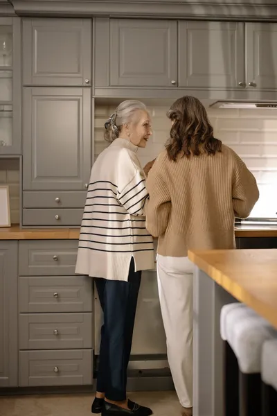 A family sitting with a professional advisor at a bright kitchen table